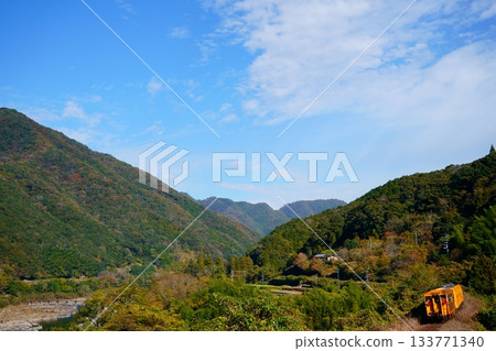 A quiet mountain scenery with the Shimantoro train 133771340