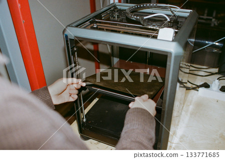 printing of three-dimensional plastic toys at factory with 3D printers. printing of three-dimensional plastic toys at factory with 3D printers. 133771685