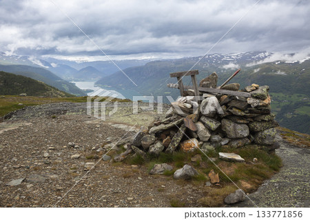 View of lake vagavatnet from top of kleivhoe mountain in randen, norway with cairn View of lake vagavatnet from top of kleivhoe mountain in randen, norway with cairn 133771856