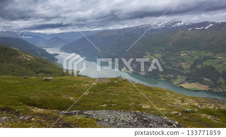 Stunning view from Kleivhoe mountain overlooking lake Vagavatnet in Randen, Norway on a cloudy day 133771859