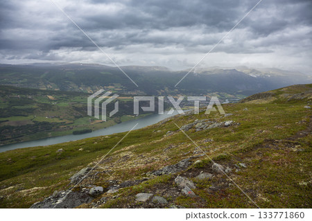 Scenic view of lake Vagavatnet from Kleivhoe mountain in Randen, Norway under a dramatic sky 133771860