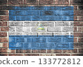 Nicaragua flag on old brick wall background 133772812