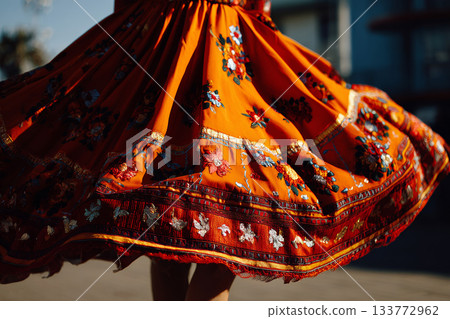 Colorful embroidered skirt spinning during dance 133772962