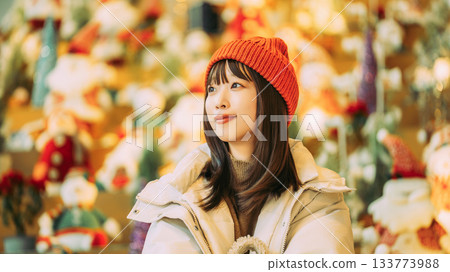 Christmas display and smiling woman Christmas display and smiling woman 133773988