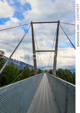 Suspension pedestrian panorama bridge over the Gummi gorge in Sigriswil, Switzerland Suspension pedestrian panorama bridge over the Gummi gorge in Sigriswil, Switzerland 133774577