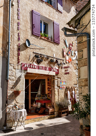 Aiguines, France - Sep 22, 2025: Picturesque old houses in the city of Aiguines in France nearby Lac de Sainte Croix. Aiguines, France - Sep 22, 2025: Picturesque old houses in the city of Aiguines in France nearby Lac de Sainte Croix. 133774734