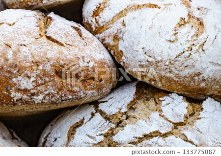 Many rustic fresh bread loaves 133775087