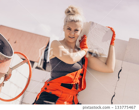 Woman working with airbricks Woman working with airbricks 133775467