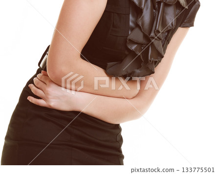 Indigestion. Closeup of woman suffering from stomach pain. Indigestion. Closeup of woman suffering from stomach pain. 133775501