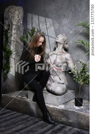 Corporate individual surrounded by lush foliage and light 133775780