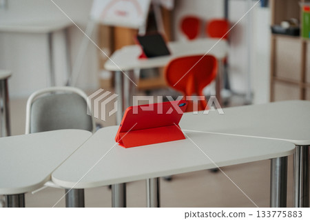 Tablet on a school desk during digital learning. 133775883