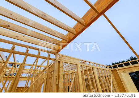 Construction of wooden frame beams for new residential building Construction of wooden frame beams for new residential building 133776191