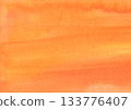 Soft orange and yellow watercolor background material with a paper texture 133776407