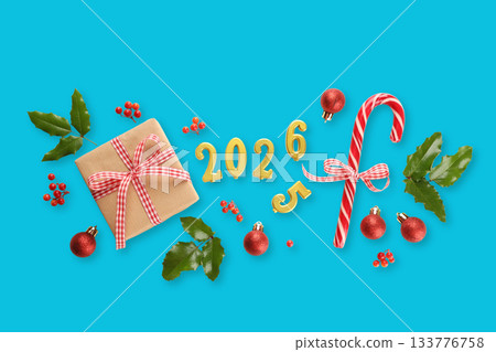 Decorations include candy canes on a bright blue surface Decorations include candy canes on a bright blue surface 133776758