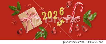 Festive display featuring ornaments, a gift, and a candy cane Festive display featuring ornaments, a gift, and a candy cane 133776764