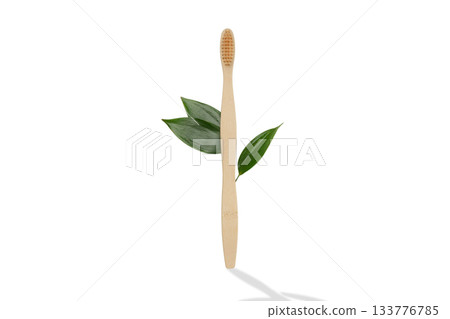 Bamboo toothbrush stands next to fresh green leaves, isolated, PNG Bamboo toothbrush stands next to fresh green leaves, isolated, PNG 133776785