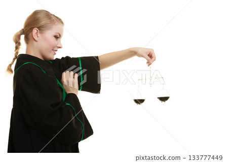 woman barrister holding scales. woman barrister holding scales. 133777449
