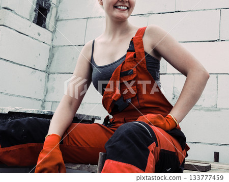 Female builder working build new house Female builder working build new house 133777459