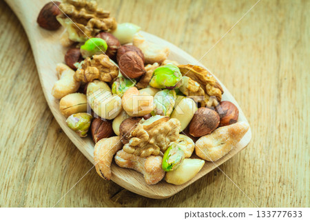 Varieties of nuts: cashew, pistachio, almond. Varieties of nuts: cashew, pistachio, almond. 133777633