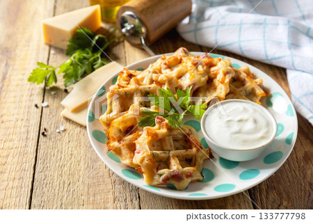 Crispy cheese waffles on a rustic background. Copy space. Crispy cheese waffles on a rustic background. Copy space. 133777798