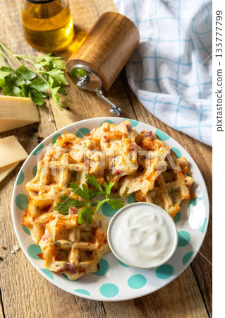 Crispy cheese waffles on a rustic background. Crispy cheese waffles on a rustic background. 133777799