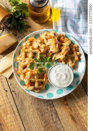 Crispy cheese waffles on a rustic background. Crispy cheese waffles on a rustic background. 133777800