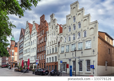 Historic houses on the Trave River embankment in Lubeck, Germany 133778126