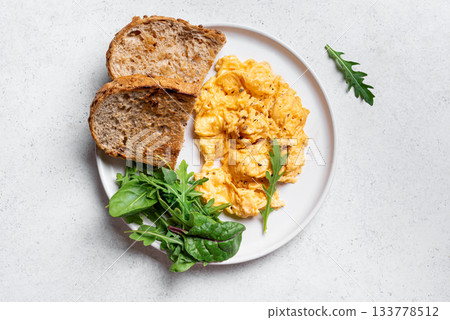 Scrambled eggs with greens for  healthy keto breakfast 133778512