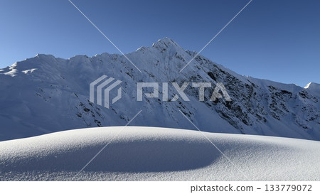 Panorama of a snow-covered mountain in Austria Alps 133779072