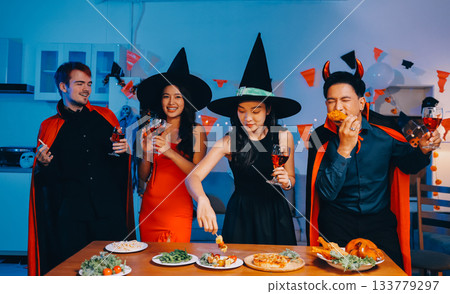 Joyful office Halloween party with coworkers in costumes, celebrating with drinks and laughter, fostering teamwork and festive spirit 133779297