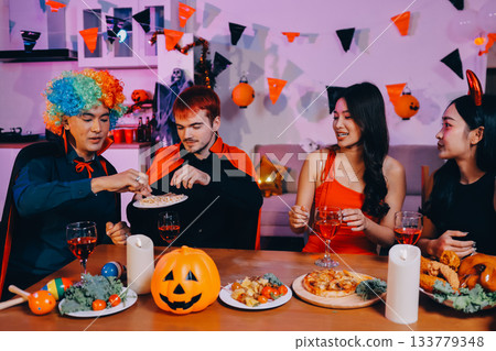 Joyful office Halloween party with coworkers in costumes, celebrating with drinks and laughter, fostering teamwork and festive spirit 133779348