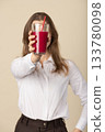 Beautiful woman drinking red juice with straw 133780098