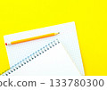 White notebook with spring, checkered notebook and pencil. 133780300