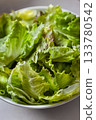Green salad in a white bowl 133780542