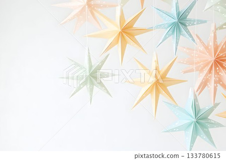 Decorative paper stars for festive Christmas celebrations in pastel colors with copy space banner background 133780615