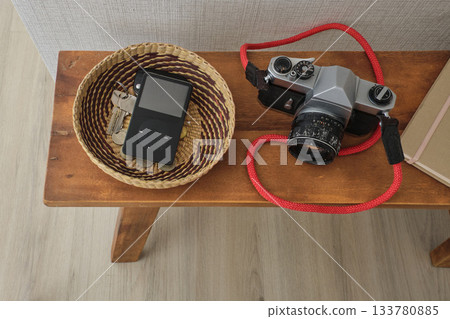 Everyday objects on wooden table displaying retro style 133780885
