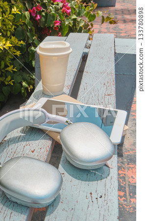 Leisure time in park with coffee and headphones 133780898