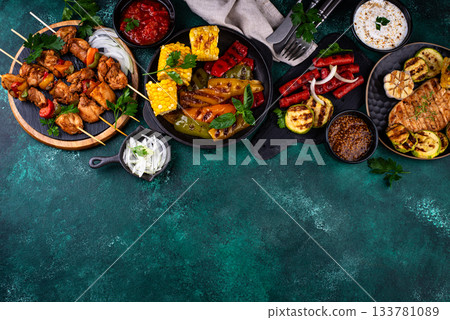 Assortment of grilled bbq meat and vegetables Assortment of grilled bbq meat and vegetables 133781089