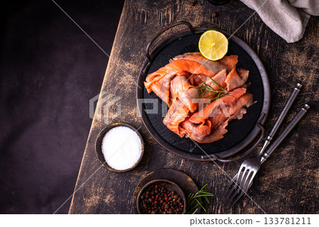Salted sliced salmon fish with herbs Salted sliced salmon fish with herbs 133781211