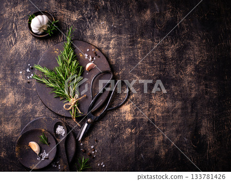 Rosemary, garlic, salt and pepper. 133781426