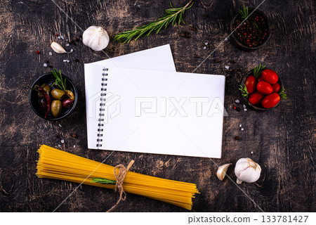 Italian food background with spaghetti, tomato and spices Italian food background with spaghetti, tomato and spices 133781427