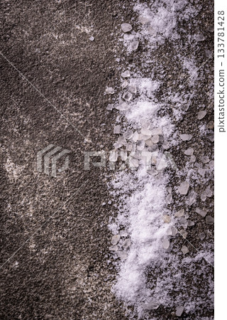 Natural sea salt crystals on dark background Natural sea salt crystals on dark background 133781428