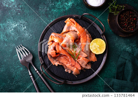 Salted sliced salmon fish with herbs 133781464