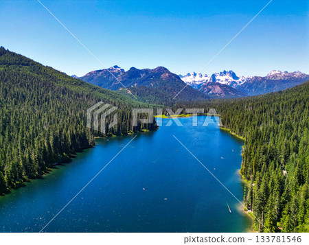 Scenic nature of popular hiking Cooper lake. Cooper lake with mountain landscape. Landscape of mountain and forest of Cooper lake. Nature landscape. Cooper Lake in Washington. Serene natural beauty Scenic nature of popular hiking Cooper lake. Cooper lake with mountain landscape. Landscape of mountain and forest of Cooper lake. Nature landscape. Cooper Lake in Washington. Serene natural beauty 133781546