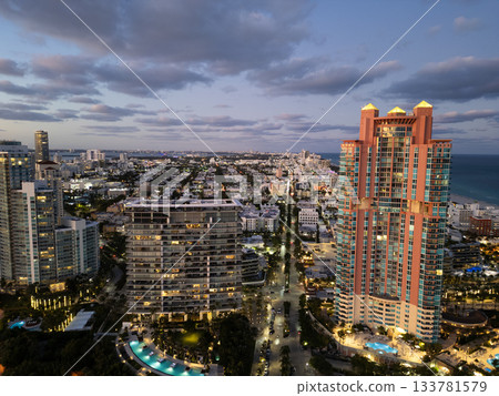 Miami South beach at night. Aerial view on skyscraper cityscape at night. Night city aerial view. Luxury skyscraper. Illuminated. City skyline in evening sundown. Aerial cityscape. Vibrant nightlife 133781579