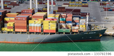 Miami, Florida - February 12, 2025: Cargo ship loaded with container in Miami, aerial. Freight container. Aerial Miami port with cargo container. Export and import. Port of Miami. Vessel with cargo 133781596