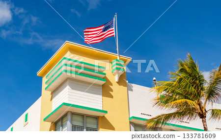 Ocean drive. Miami South Beach in Ocean Drive. Art Deco building architecture. Architectural building. Historic District. Art deco architectural district. Art Deco. Modern building with American flag Ocean drive. Miami South Beach in Ocean Drive. Art Deco building architecture. Architectural building. Historic District. Art deco architectural district. Art Deco. Modern building with American flag 133781609