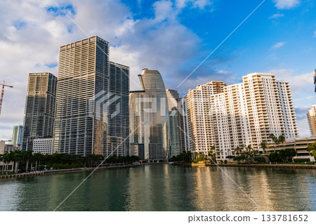 Brickell Key. Waterfront building architecture. Residential skyscraper. Modern waterfront building. Skyscraper in sunset city. City skyscraper building. Residential building architecture. Skyline 133781652