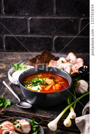 Traditional Ukrainian borsch with sour cream 133781654
