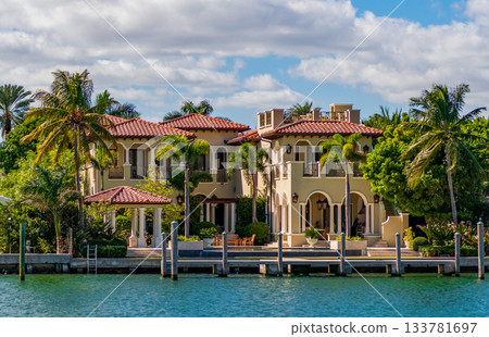 Waterfront landscape with house. Vacation in summer. Luxury waterfront hotel building. Summer vacation. Landscape with luxury residential area. Residential waterfront apartment. Luxury villa 133781697